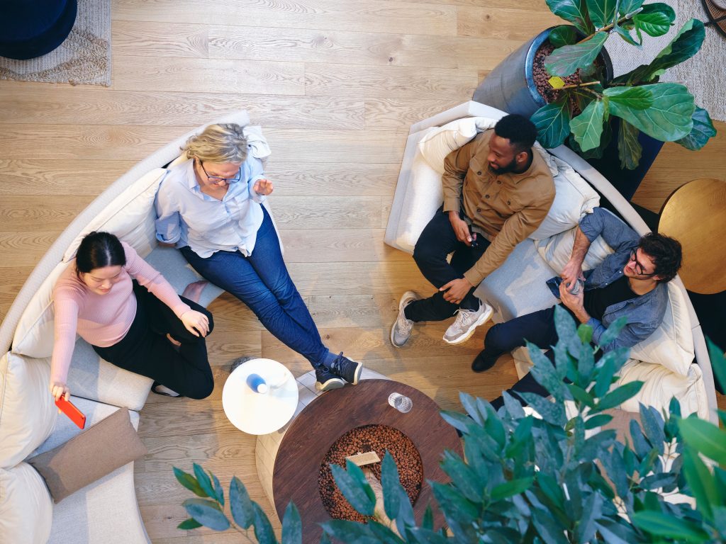 UK, London, Overhead view of coworkers relaxing in office lobby