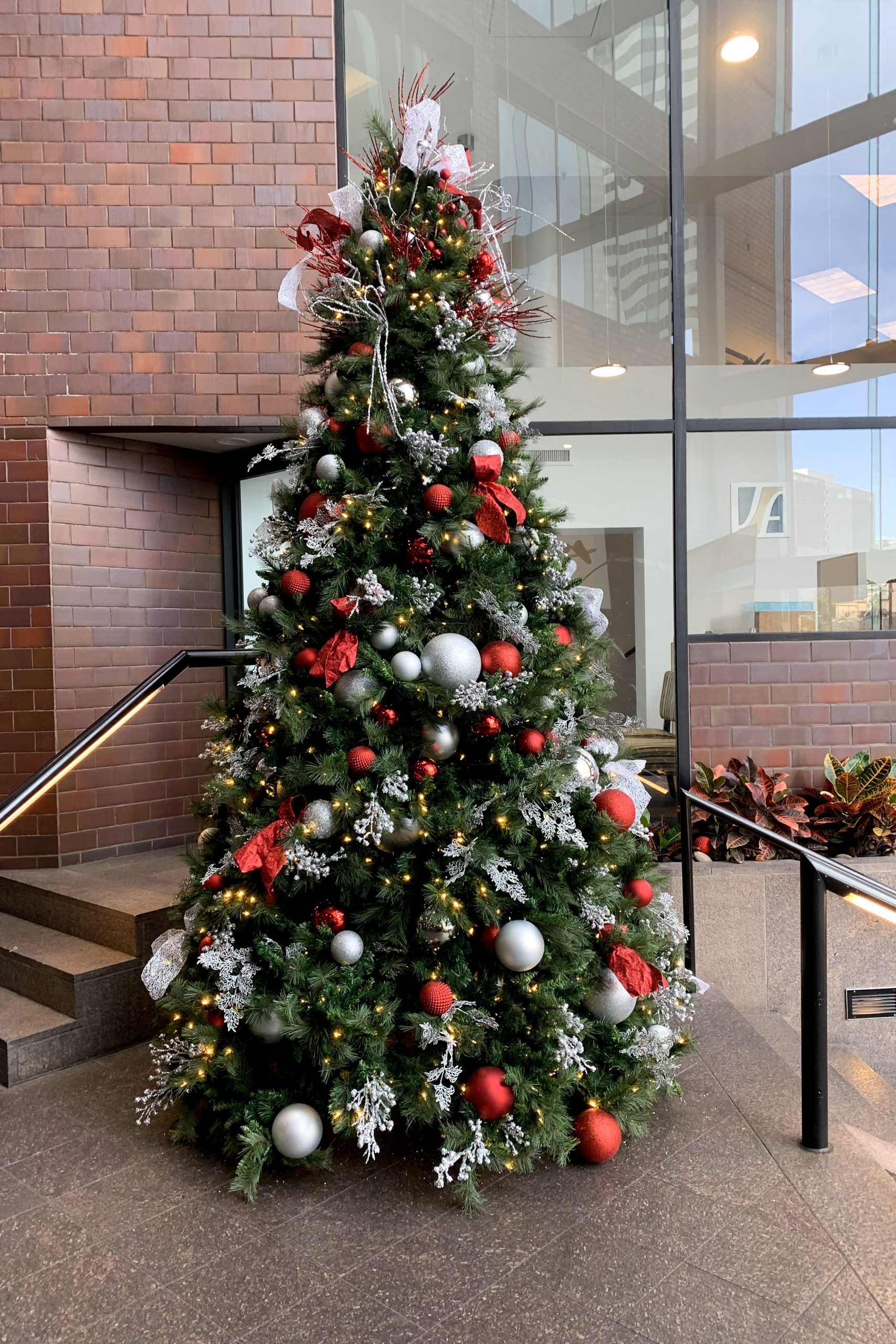 Lobby tree with layered ornaments and lighting