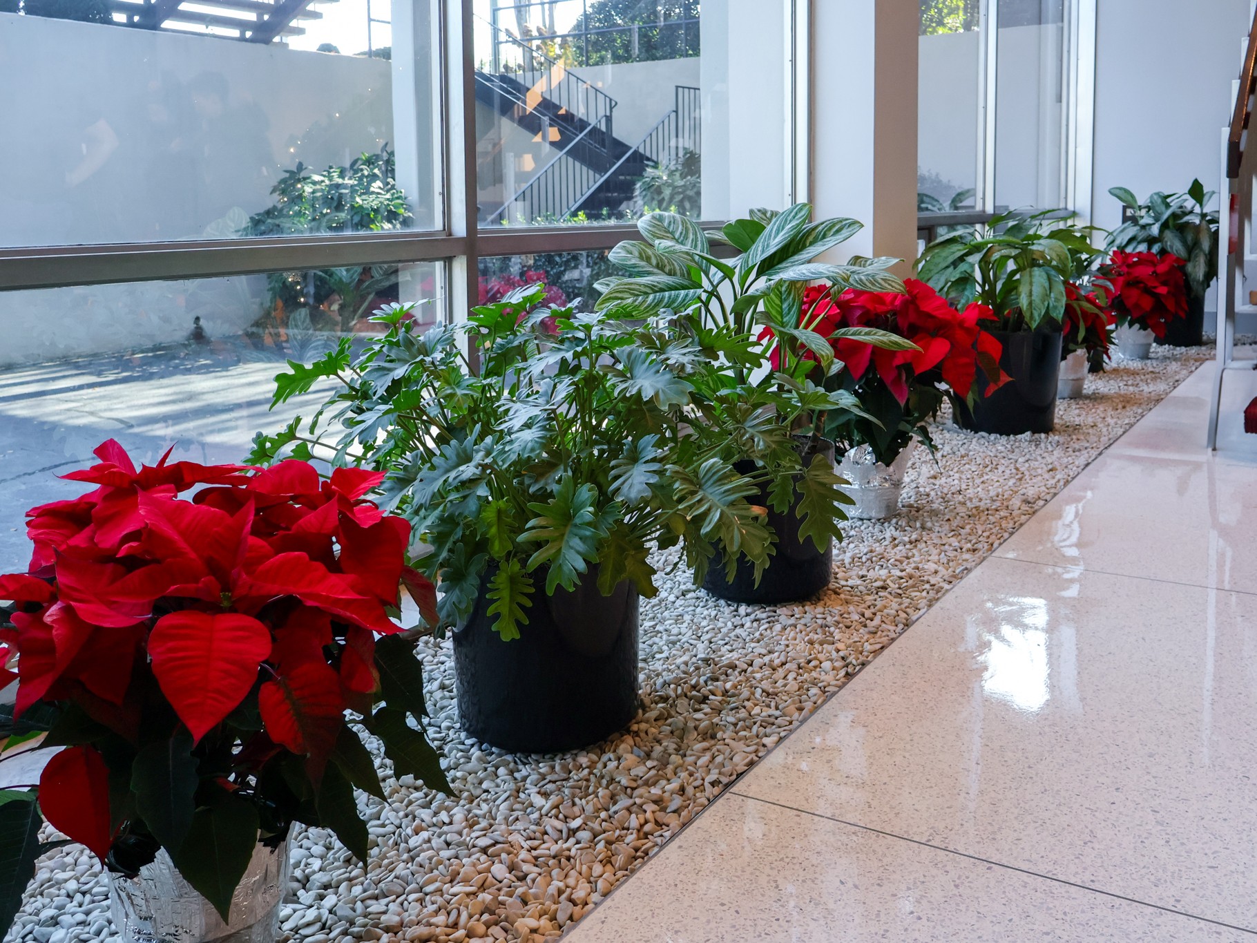 Holiday garland and wreath detail in a lobby